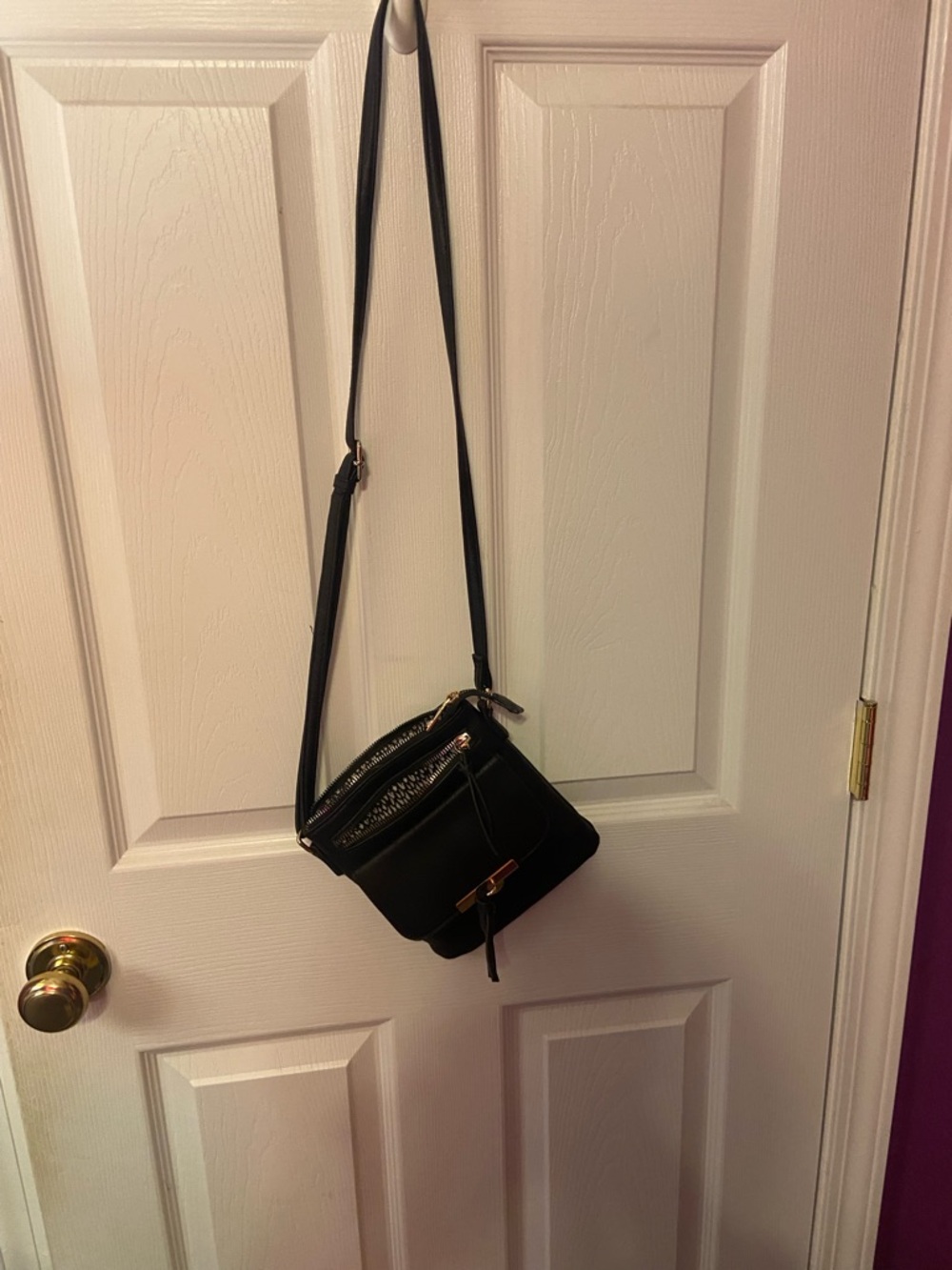 Stylish Black Crossbody Bag with Gold Hardware
